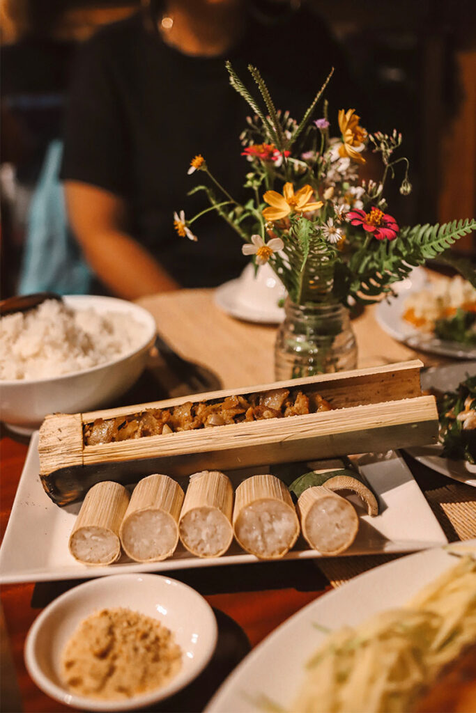 Grilled pork in bamboo tube served with bamboo rice